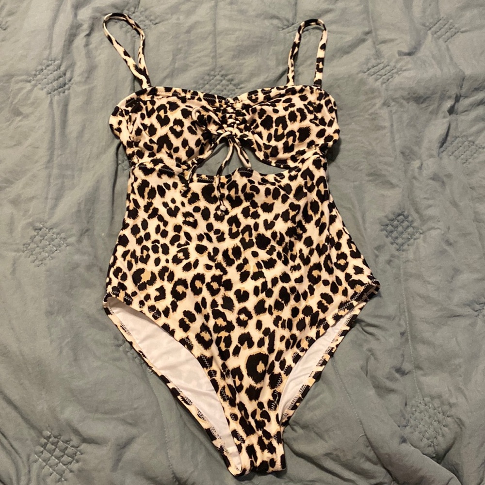 Old Navy cheetah print cutout one piece, small, never worn, perfect condition.